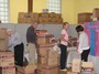 Stu Lawrence, Mark Treadup and Kristen Morgan unpacking more toys